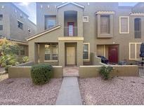 Two-story townhome with front yard landscaping and gated entry at 6710 E University Dr # 147, Mesa, AZ 85205