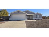 Single-story home with a two-car garage and desert landscaping at 9321 W Hillcrest Pl, Arizona City, AZ 85123