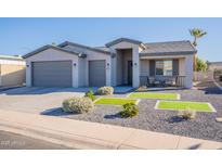 Single-story home with gray exterior, two-car garage, and landscaped front yard at 2743 N Lema Dr, Mesa, AZ 85215
