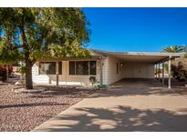 White single story home with carport and driveway at 430 S 81St Pl, Mesa, AZ 85208