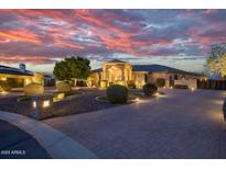 Stunning curb appeal with a meticulously landscaped front yard and a grand entrance at 9968 W Jj Ranch Rd, Peoria, AZ 85383