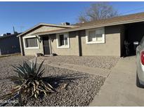 Ranch style home with a landscaped front yard and driveway at 2122 W Laurel Ln, Phoenix, AZ 85029