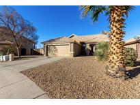 Single-story home with a two-car garage and desert landscaping at 474 E Jasper Dr, Gilbert, AZ 85296