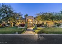 Elegant home with landscaped grounds and a gated entryway at 7130 E Berneil Ln, Paradise Valley, AZ 85253