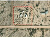 Aerial view of a property with multiple structures on a large lot at 735 S Ruby Rd, Maricopa, AZ 85139