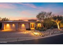 Beautiful desert home with a three-car garage and landscaped yard at sunset at 12544 N 120Th Pl, Scottsdale, AZ 85259