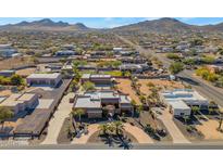 Aerial view of a luxurious house with a large yard and circular driveway, located in a residential area at 2625 W Desert Hills Dr, Phoenix, AZ 85086
