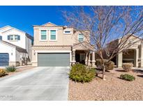 Two-story house with gray garage door and landscaping at 4726 E Chromium Rd, San Tan Valley, AZ 85143
