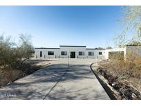 Stunning modern home with clean lines and a long driveway at 6516 N 43Rd Pl, Paradise Valley, AZ 85253