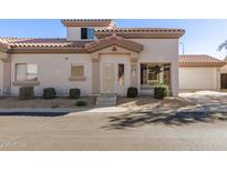 Attractive stucco home with a two-car garage and well-manicured landscaping at 15763 N 79Th Dr, Peoria, AZ 85382