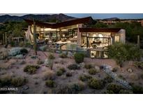 Luxury home with pool, desert landscaping, and mountain views at 38300 N 102Nd St, Scottsdale, AZ 85262