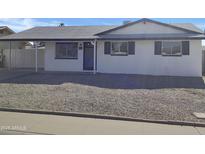 Newly renovated home with fresh exterior paint and landscaping at 4619 W Mission Ln, Glendale, AZ 85302