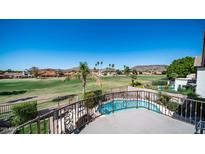 Balcony view of a luxurious backyard with a pool and golf course at 6178 W Quail Ave, Glendale, AZ 85308