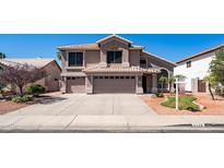 Charming two-story home featuring a three car garage and well-manicured landscaping at 6178 W Quail Ave, Glendale, AZ 85308