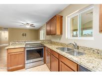 Modern kitchen features granite countertops and stainless steel appliances at 9607 N 41St Dr, Phoenix, AZ 85051