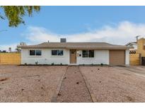 Updated single-story home with new paint, landscaping, and a two-car garage at 1603 W Alcott St, Mesa, AZ 85201