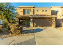 Two-story house with green door and attached garage at 728 E Payton St, San Tan Valley, AZ 85140