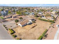 Aerial view showing a single-story house with a large yard and surrounding neighborhood at 21113 S 223Rd Way, Queen Creek, AZ 85142