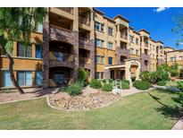 Building 1 exterior features stone accents and landscaping at 5450 E Deer Valley Dr # 2023, Phoenix, AZ 85054