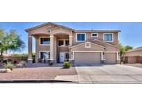 Two-story house with a large driveway and landscaped front yard at 11232 N 152Nd Ln, Surprise, AZ 85379