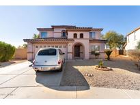 Two-story house with a two-car garage and desert landscaping at 4826 S 26Th Ln, Phoenix, AZ 85041
