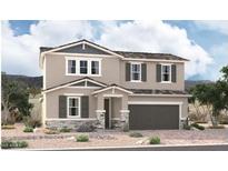 Two-story house with gray siding, stone accents, and a two-car garage at 5021 W Roundhouse Rd, Laveen, AZ 85339