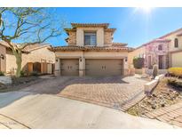 Two-story home with two-car garage and stone accents at 6825 E Pearl St, Mesa, AZ 85207