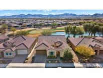 Aerial view of home with stunning mountain views and golf course location at 26573 W Abraham Ln, Buckeye, AZ 85396