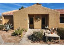 Tan stucco building with walkway and desert landscaping at 3511 E Baseline Rd # 1259, Phoenix, AZ 85042
