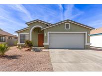 Green single-story house with a two-car garage and well-maintained landscaping at 5802 S 14Th St, Phoenix, AZ 85040