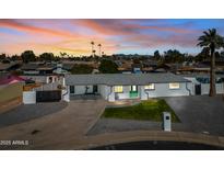 Newly remodeled home with a large front yard, aerial view at 1344 E Ellis Cir, Mesa, AZ 85203