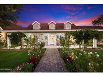 Stunning stone house with landscaped front yard and brick pathway at 455 N 39Th Way, Mesa, AZ 85205