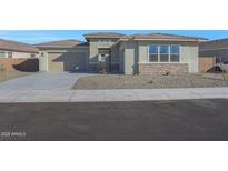 Single-story home with attached garage and landscaped front yard at 13528 W Phacelia Ln, Peoria, AZ 85383