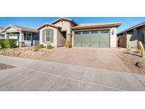 Single-story home with a two-car garage and landscaped front yard at 3392 E Strawberry Dr, Gilbert, AZ 85298