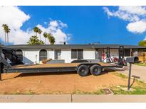 Ranch style home with a large front yard and a long driveway at 3502 W Ironwood Dr, Phoenix, AZ 85051