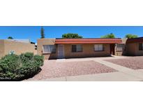 Attractive exterior of a single-story home with a red roof and well-maintained landscaping at 5323 N 19Th Ave # 24, Phoenix, AZ 85015