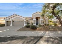 Single-story home with a two-car garage and desert landscaping at 5403 E Cannon Dr, Paradise Valley, AZ 85253