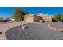 Single-story home with a gravel front yard and attached garage at 1132 W 21St Ave, Apache Junction, AZ 85120