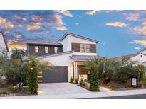 Two-story modern home with gray garage and landscaped front yard at 15577 S 181St Ln, Goodyear, AZ 85338