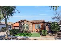 Beautiful single-story home with stone accents and a welcoming front yard at 20882 W Eastview Way, Buckeye, AZ 85396