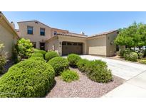 Two-story home with a two-car garage and manicured landscaping at 3554 N Hooper St, Buckeye, AZ 85396