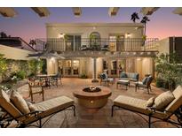 Spacious backyard patio with fire pit and seating at 7500 E Mccormick Pkwy # 78, Scottsdale, AZ 85258