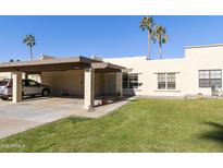 Cute condo with carport and grassy yard at 7756 E Coralbell Ave, Mesa, AZ 85208