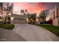 Charming home with a large driveway, mature trees, and a beautiful stucco exterior at sunset at 7878 E Gainey Ranch Rd # 41, Scottsdale, AZ 85258