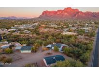 Aerial view showing a house with mountain backdrop and surrounding desert landscape at 843 N Arroya Rd, Apache Junction, AZ 85119