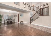 Spacious living area with hardwood floors and staircase at 1540 W Orchid Ln, Chandler, AZ 85224