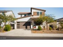 Modern two-story house with attached garage and landscaped front yard at 15541 S 181St Ln, Goodyear, AZ 85338