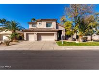 Two-story house with a three-car garage and landscaped front yard at 16614 N 51St St, Scottsdale, AZ 85254