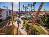 Resort-style community with pool and lush landscaping at 17404 N 99Th Ave # 205, Sun City, AZ 85373