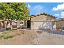 Single-story house with a two-car garage and a landscaped front yard at 1866 E Dust Devil Dr, San Tan Valley, AZ 85143